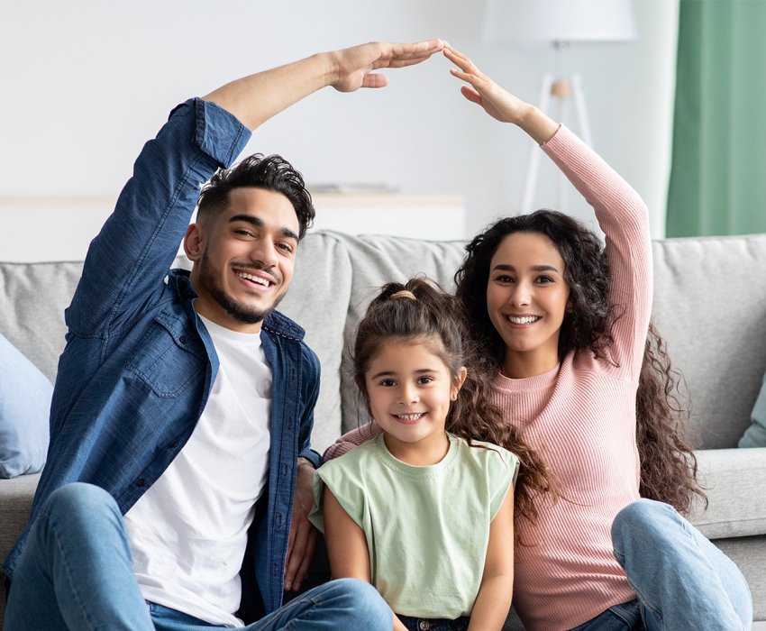 Family Protection. Mom And Dad Making Roof Of Hands Above Their Daughter