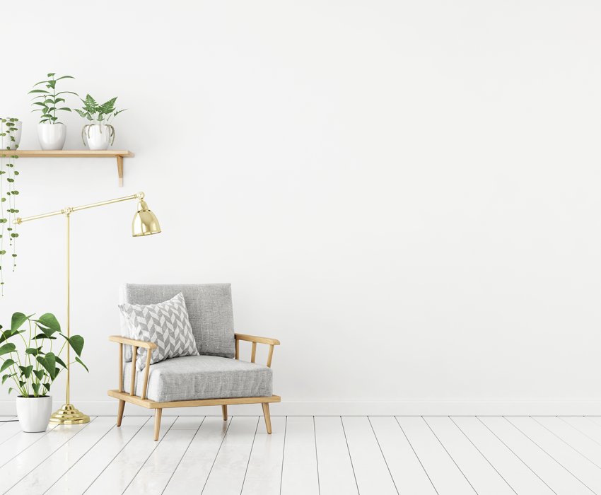 Scandinavian style livingroom with gray fabric armchair, golden lamp and plants on empty white wall background. 3d rendering.