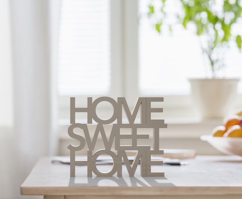 Table top with 3D letters making the words home sweet home